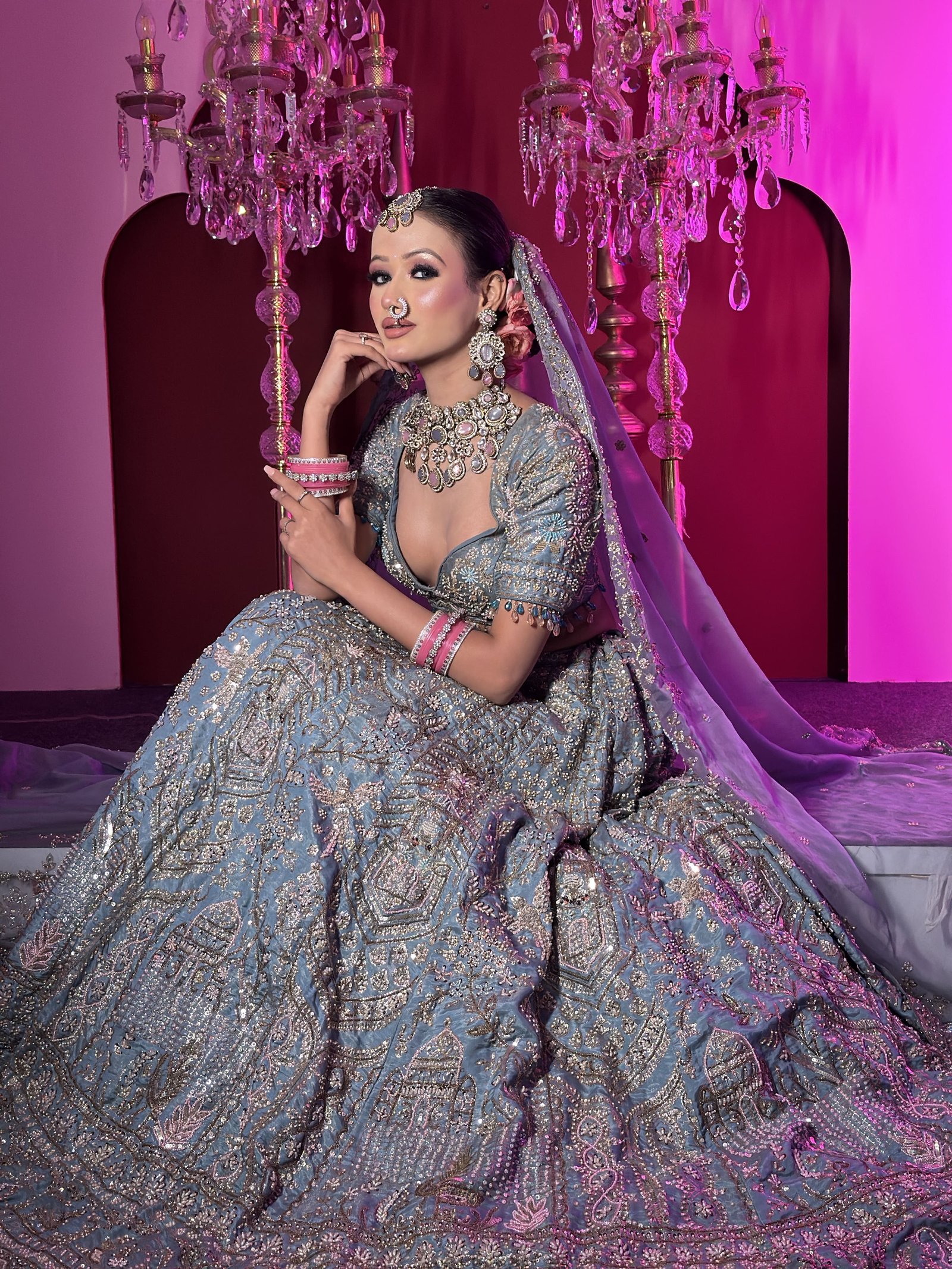 Bridal makeup artist creating a bridal look in Faridabad